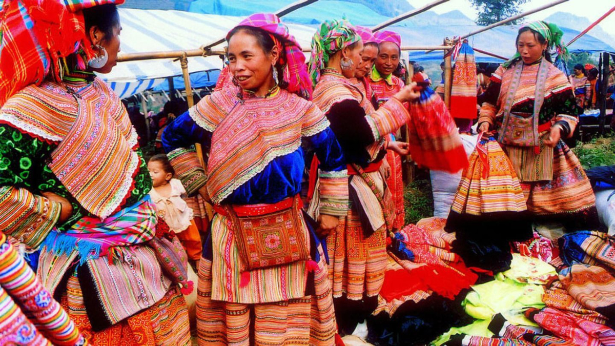 The hill tribe markets around Sapa are where ethnic communities gather in dazzling traditional dress to trade goods, share stories, and celebrate local life